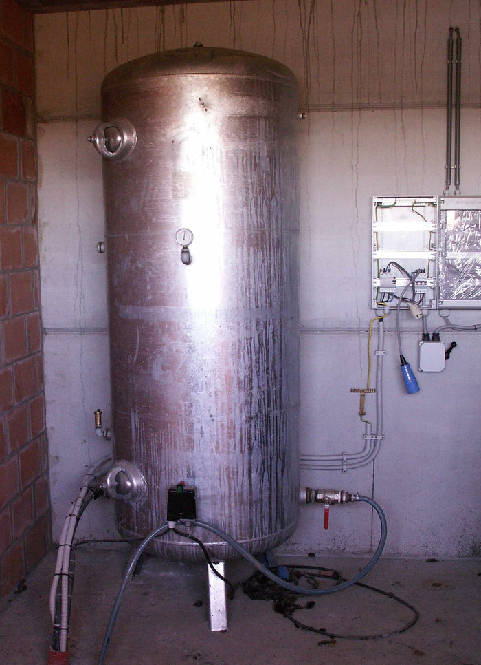 Large well water pressure tank with a pump and pressure controls