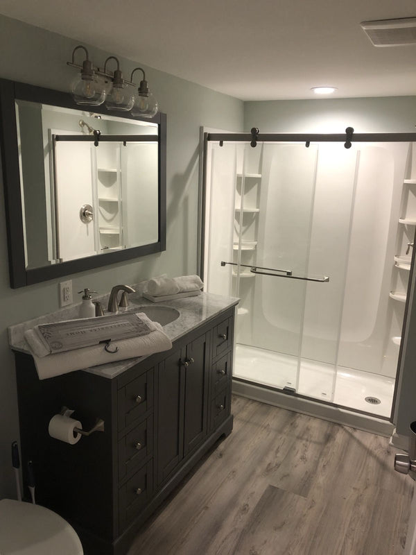 Bathroom remodel with a new vanity and walk-in shower
