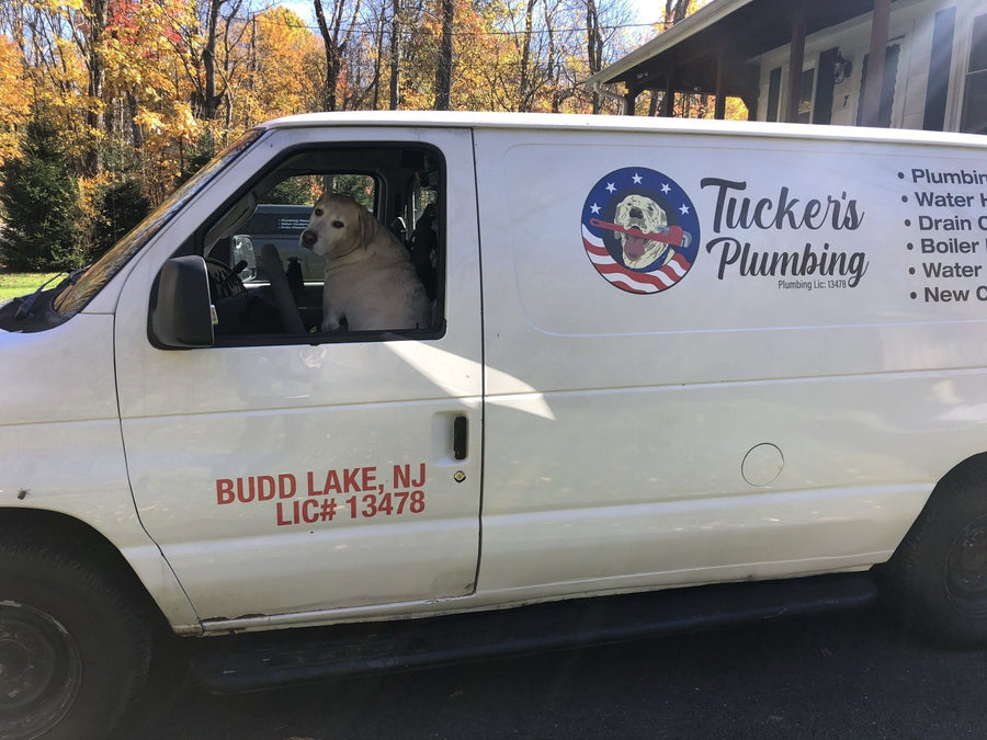 Tucker's Plumbing work van with the company logo, Budd Lake NJ and license number