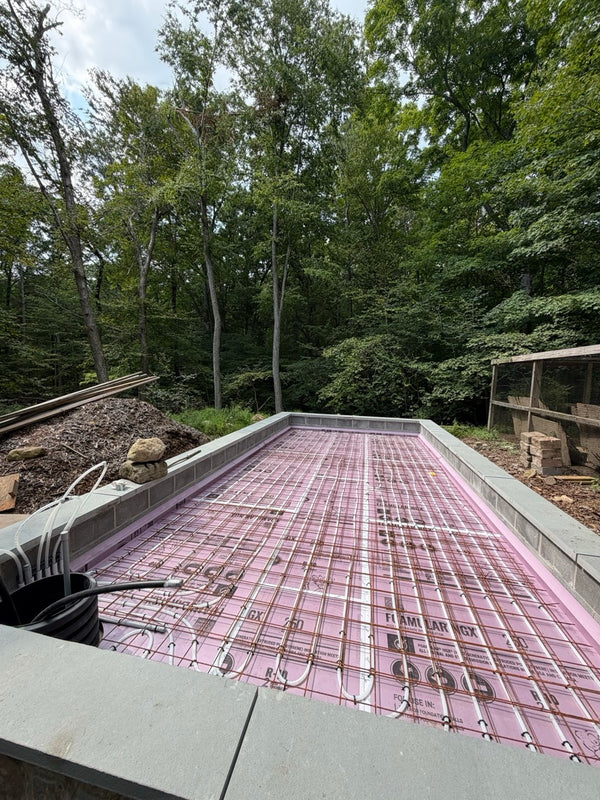 Radiant floor heat tubing before the slab pour